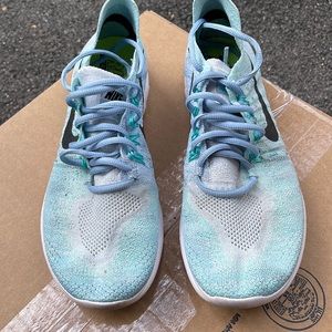 Nike.  Used, but good condition.  Baby blue and super comfy!